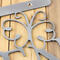 Close up of raw steel on the garden hanging sign.