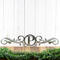 Metal monogram sign with vines, in raw steel.