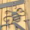 Close up of silver vein powder coat on the garden hanging sign.