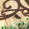 Close up of copper vein powder coat on our metal monogram sign.