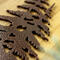 Close up of copper vein powder coat on our metal house number sign.