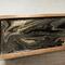 Close up of the design on this black and gold tea box.  Metallic gold shimmers in swirls of black and brown.  Holds up to 50 tea bags.  Time for a tea party!