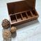 5-compartment in this wooden tea box for organizing tea bags.