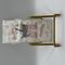 Laminated bookmark with stack of books with pink bow, iced coffee, on pink floral background 