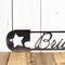 Close up of our baby nursery boy or girl metal safety pin sign with star, in raw steel.