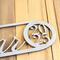 Close up of raw steel on our newborn baby boy or girl name and birthday metal sign.