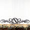 Metal monogram sign with vines, in matte black powder coat.