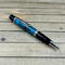 Turquoise resin and pinecones pen