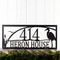 Personalized hanging rectangular metal address sign with great blue heron, cattails, and sunset image, in matte black powder coat.