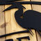 Close up of matte black powder coat on our custom metal address plaque with a great blue heron and cattails lake scene.