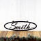 Oval family last name metal sign with script font, in matte black powder coat.