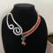Ember
A beautiful orange glass bead paired with a coral color pearl 