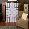 Modern quilt in shades of blue. 53 X 67. Solid fabrics on front; floral print on the back. Pattern is geometric inspired by a garden maze.
