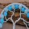 top view silver branches adorned with various light blue color beads