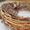 closeup grapevine wreath with brown aluminum wire roots attached
