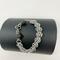 Agate stones of gray and black mixed with chain maille and a rhinestone-encrusted black toggle clasp. 