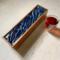 Elegant design of dark blue background and white and silver waves on this tea organizer.