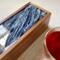 Silver floats on top of rhe resin of this tea organizer holding up to 50 tea bags.