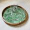 Serve up your favorite cocktails and bring appetizers out to the garden with this large green and white serving tray.