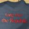 Back of the navy tee-shirt says "Long Live the Republic."  in red letters.