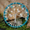 pretty compact wire tree of life wrapped in blue light blue yarn and adorned with pearl beads