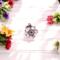 round silver flower charm