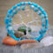 sky blue fluffy yarn wrapped hoop and aluminum wire creates this adorable tree of life. It is adorned with blue beads