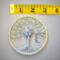 A measuring tape shows the small size of 3 inches. The tree is small but makes a bif appearance in any room