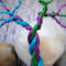 colorful branches splay away from braided trunk 