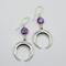 Handmade earrings with amethyst coin beads and stainless steel crescent moons, Argentium sterling ear wires, 2.25 inches long.