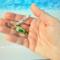 Cute and vibrant personalized fish charm for purses, backpacks, keychains, etc.Green fish charm in hand to show size.