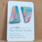 Asymmetrical earrings on card