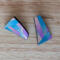 Asymmetrical earrings inlaid with stripes of gradients of teal to gold and mauve to gold