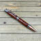 Exotic hardwood cowboy themed pen in antique copper 