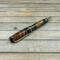 Worthless wood cut off cast in black and gold resin 