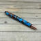 Bright copper cigar pen made with turquoise and copper resin