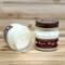 Banana bread scented soy candle in 8oz mason jar. One jar standing up with lid on and one jar on its side with lid off.