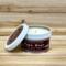 Maple, apple and cinnamon scented soy candle in 6oz tin with lid off.