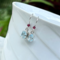Blue topaz and garnet earrings in sterling silver by MariesGems.