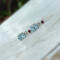 Blue topaz and garnet earrings in sterling silver by MariesGems.