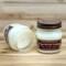 Gingerbread scented soy candle in 8oz mason jar. One jar standing up with lid on and one jar on its side with lid off.