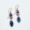 Handmade earrings with faceted sodalite beads and copper wire spirals, 2.5 inches long, ocean-inspired boho jewelry.