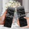man and Woman holding bride tumbler near a wedding bouquet
