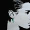 Face profile silhouette wearing a crescent moon earring with star bead