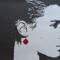 Face silhouette with deep rose earring