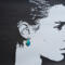 Picture showing silhouette of face with earring on ear