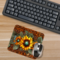 Mouse pad on rustic wooden desk with laptop
