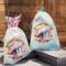 Burlap bag your ornament arrives in (design and color may vary with season). Fantastic for gift giving and storage!