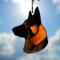 German Shepherd Ornament in Black and Red, in direct sunlight.