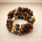 wood bead wrap bracelet with a metal butterfly charm. This is very charming.